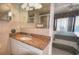 Ensuite bathroom features granite counters, vanity with seated makeup area, and shower at 4435 S Atlantic Ave # 416, Port Orange, FL 32127