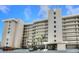 Low angle of exterior of building called Sandcastle North, showing entry and multi-story balconies at 4435 S Atlantic Ave # 416, Port Orange, FL 32127
