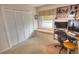Bright, carpeted home office featuring built in storage, and a built in window bench at 4435 S Atlantic Ave # 416, Port Orange, FL 32127