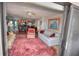 Cozy living room showcases access to kitchen, lovely furnishings, and views from sliding glass doors to the patio at 4435 S Atlantic Ave # 416, Port Orange, FL 32127