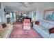 Spacious living room open to the dining and kitchen areas with comfortable furnishings at 4435 S Atlantic Ave # 416, Port Orange, FL 32127