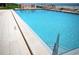Swimming pool with blue water and a tile patio, ready for a refreshing dip at 4435 S Atlantic Ave # 416, Port Orange, FL 32127