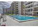 View of the complex pool featuring lounge chairs and an ocean view at 4435 S Atlantic Ave # 416, Port Orange, FL 32127