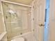 Bathroom with glass shower enclosure, with a clear door and white tile surround at 4575 S Atlantic Ave # 6203, Ponce Inlet, FL 32127