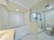 Bathroom featuring a soaking tub, glass-enclosed shower, and a toilet at 4575 S Atlantic Ave # 6203, Ponce Inlet, FL 32127