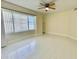 Bedroom featuring large windows, white tile flooring and natural light at 4575 S Atlantic Ave # 6203, Ponce Inlet, FL 32127