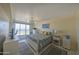 Bright bedroom features stylish decor, tile floors and ocean views at 4575 S Atlantic Ave # 6203, Ponce Inlet, FL 32127