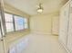 Bright bedroom with large window offering a serene view, paired with ceiling fan and ample closet space at 4575 S Atlantic Ave # 6203, Ponce Inlet, FL 32127
