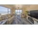 Bright living room with beach views at 4575 S Atlantic Ave # 6203, Ponce Inlet, FL 32127