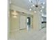 Open living area with white tile flooring and contemporary lighting at 4575 S Atlantic Ave # 6203, Ponce Inlet, FL 32127