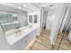 Bathroom featuring double sinks, sleek countertops, and modern mirrors at 4620 Riverwalk Village Ct # 7403, Ponce Inlet, FL 32127