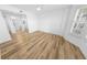 Bright bedroom featuring wood-look floors, white walls, and a ceiling fan at 4620 Riverwalk Village Ct # 7403, Ponce Inlet, FL 32127