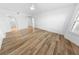 Bright bedroom with wood floors, ceiling fan, and natural light at 4620 Riverwalk Village Ct # 7403, Ponce Inlet, FL 32127