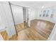 Bright bedroom with closet, wood floors and window at 4620 Riverwalk Village Ct # 7403, Ponce Inlet, FL 32127