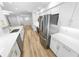 Bright and open kitchen featuring stainless steel appliances, and sleek white cabinetry at 4620 Riverwalk Village Ct # 7403, Ponce Inlet, FL 32127
