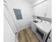 Convenient laundry room with wood-look floors, overhead cabinets, and a washer and dryer at 4620 Riverwalk Village Ct # 7403, Ponce Inlet, FL 32127