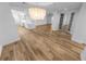 Spacious living space with wood floors, modern lighting, and French doors at 4620 Riverwalk Village Ct # 7403, Ponce Inlet, FL 32127