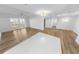 Sun-filled living space with wood floors, modern lighting, and open floorplan at 4620 Riverwalk Village Ct # 7403, Ponce Inlet, FL 32127