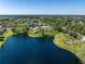 Beautiful aerial view overlooking the community, its lakes, and luscious landscaping at 511 Mount Olympus Blvd, New Smyrna Beach, FL 32168