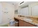 Bathroom featuring a granite vanity, and a toilet with a decorative basket at 511 Mount Olympus Blvd, New Smyrna Beach, FL 32168