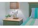 Close-up view of the nightstand lamp and fish figurine near the bedroom bed at 511 Mount Olympus Blvd, New Smyrna Beach, FL 32168
