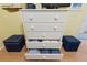 Coastal-style dresser with open drawers, decorative pulls, and adjacent storage cubes at 511 Mount Olympus Blvd, New Smyrna Beach, FL 32168