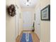 Hallway with tile flooring, closet and beach themed decor at 511 Mount Olympus Blvd, New Smyrna Beach, FL 32168