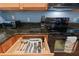 Kitchen cutlery drawer with a selection of stainless steel utensils at 511 Mount Olympus Blvd, New Smyrna Beach, FL 32168