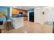 Bright eat-in kitchen with light wood flooring, granite counters, and wood cabinets at 511 Mount Olympus Blvd, New Smyrna Beach, FL 32168
