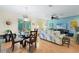 Bright living area with a dining table, screened in patio and comfortable furniture at 511 Mount Olympus Blvd, New Smyrna Beach, FL 32168