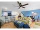 Open-concept living room with breakfast bar and comfortable seating at 511 Mount Olympus Blvd, New Smyrna Beach, FL 32168