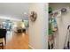Open-concept living space featuring hardwood floors, neutral walls, and doorway storage closet at 511 Mount Olympus Blvd, New Smyrna Beach, FL 32168