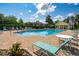 A great community pool with a pool house and plenty of chaise lounges at 511 Mount Olympus Blvd, New Smyrna Beach, FL 32168