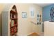 Stairway area featuring built-in bookcase, decorative pictures, and natural light at 511 Mount Olympus Blvd, New Smyrna Beach, FL 32168