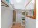 Organized walk-in closet with shelving, hanging rods, and ample storage space at 511 Mount Olympus Blvd, New Smyrna Beach, FL 32168
