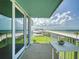 Enjoy the ocean view from the balcony with white railings and a small outdoor table at 5201 S Atlantic Ave # 407A, New Smyrna Beach, FL 32169