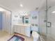 Bright bathroom featuring vanity, and glass enclosed shower at 5201 S Atlantic Ave # 407A, New Smyrna Beach, FL 32169