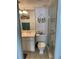 Bathroom with toilet, vanity, and glass-enclosed shower at 5201 S Atlantic Ave # 407A, New Smyrna Beach, FL 32169