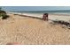 Lifeguard chair on a sandy beach with ocean views at 5201 S Atlantic Ave # 407A, New Smyrna Beach, FL 32169