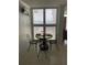 Cozy dining area with window overlooking the ocean view at 5201 S Atlantic Ave # 407A, New Smyrna Beach, FL 32169