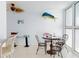 Cozy dining area with seating for four and lots of natural light at 5201 S Atlantic Ave # 407A, New Smyrna Beach, FL 32169