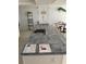 Kitchen island featuring a sink with tile countertop, and decor at 5201 S Atlantic Ave # 407A, New Smyrna Beach, FL 32169