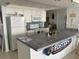 Kitchen with white appliances and tile countertop island at 5201 S Atlantic Ave # 407A, New Smyrna Beach, FL 32169
