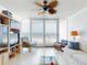 Bright living room featuring white furnishings and floor-to-ceiling windows with ocean views at 5201 S Atlantic Ave # 407A, New Smyrna Beach, FL 32169