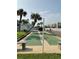 Community shuffleboard court surrounded by lush landscaping at 5201 S Atlantic Ave # 407A, New Smyrna Beach, FL 32169