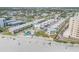 High angle view of a beachfront condo complex showcasing a community pool and manicured landscaping at 525 N Atlantic Ave # 39, New Smyrna Beach, FL 32169