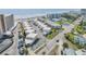 Aerial view of condo complex situated by the beach with community pool, tennis courts, and private parking at 525 N Atlantic Ave # 39, New Smyrna Beach, FL 32169