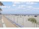 Scenic beach view from the property showcasing sand, ocean, and parked cars at 525 N Atlantic Ave # 39, New Smyrna Beach, FL 32169