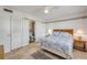 Inviting bedroom boasts a queen-size bed, en-suite bathroom, and ample natural light at 525 N Atlantic Ave # 39, New Smyrna Beach, FL 32169