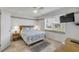 Relaxing bedroom with plush queen-size bed and a large window with outside views at 525 N Atlantic Ave # 39, New Smyrna Beach, FL 32169